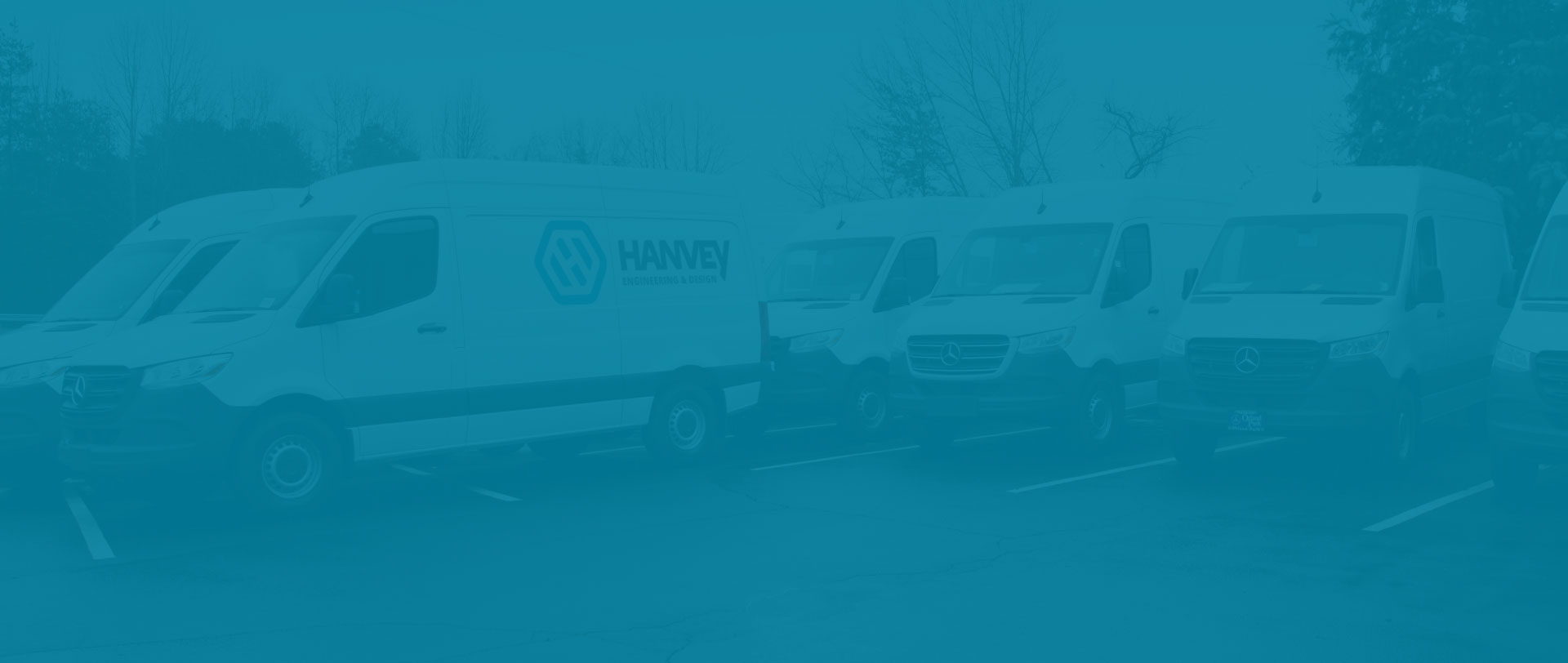 Hanvey grooming vans parked in a row